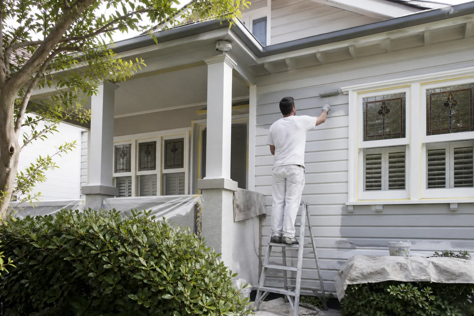 Painter coating a Wairau Valley commercial premises