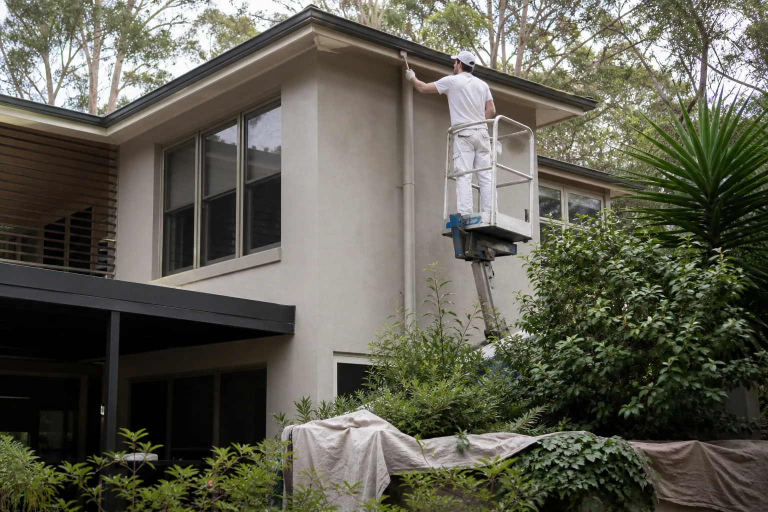 Painter working on a Browns Bay beachside home