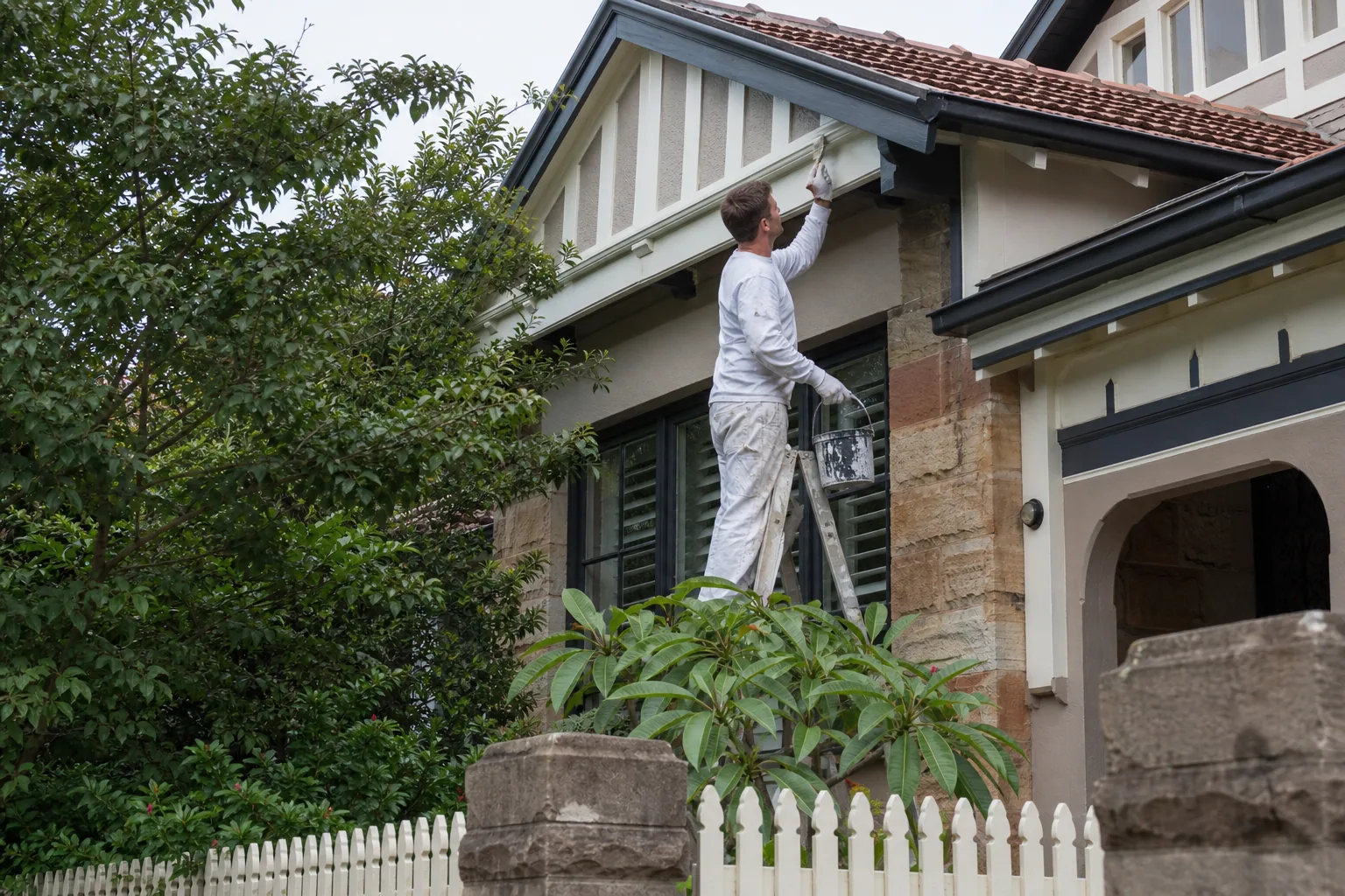 Painter refreshing a Birkenhead character villa